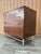 Vintage Refinished Mid Century Modern Chest of Drawers By John Stuart. Circa 1960s. Features a quintessential Sleek Mid...