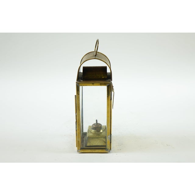 Antique Brass Lantern – 5ʺW × 4ʺD × 12.5ʺL Illuminate your space with vintage charm using this classic antique brass...