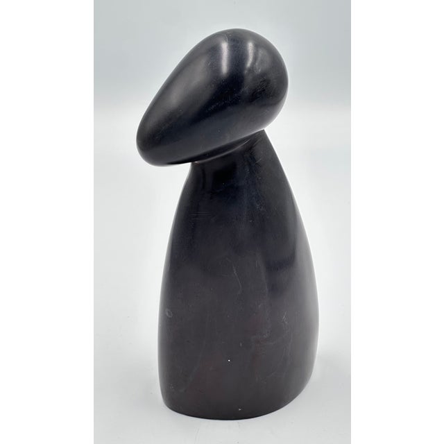 Discover the timeless elegance of this stunning Vintage Modernist Carved Stone Sculpture. Hand crafted with meticulous...