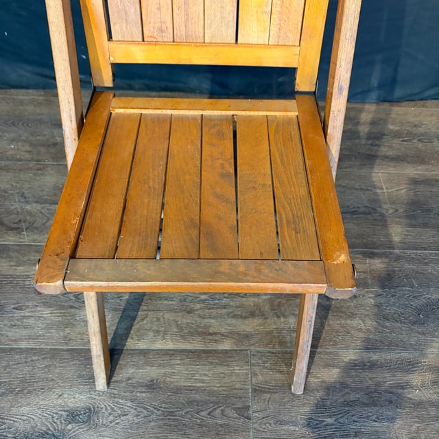 Set of 12 vintage 1940s folding antique chairs in beech with metal details. Each chair does a flip when unfolded and is...