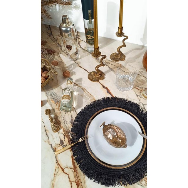 Highly decorative pair of candleholders that will not go unnoticed on any table setting. This is a pair of sculptural...
