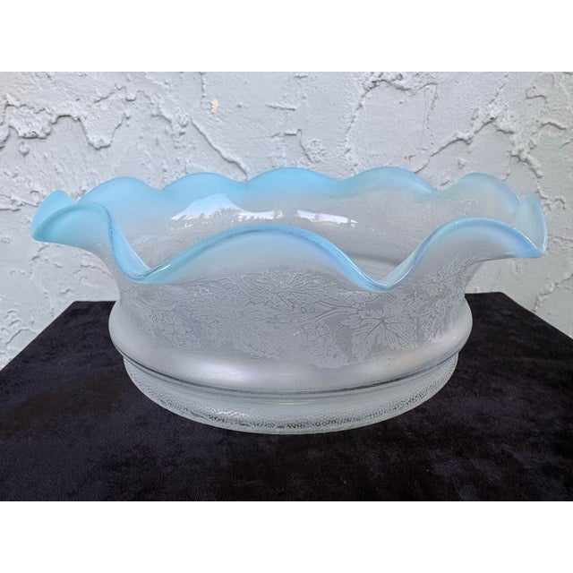 This elegant antique American pressed glass bowl features a beautifully sculpted ruffled rim in soft blue opalescent...