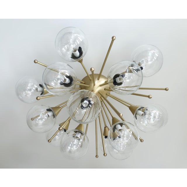 Italian sputnik flush mount with clear Murano glass globes mounted on solid brass frame in satin brass finish / Made in...