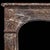 A rouge royal marble louis xv antique fireplace mantel in rococo style, the serpentine shelf above the paneled frieze...