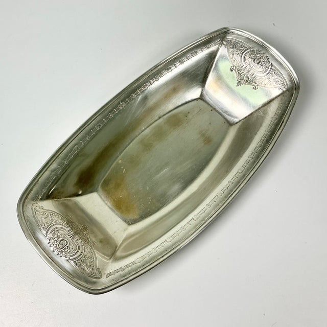 Vintage Home is pleased to offer this antique English Chippendale Art Deco style silver plated Relish or Bread Tray. It...