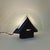 Table lamp with a geometric design, typical of the post modern 80s. Black metal base, triangular front glass, semicircular...