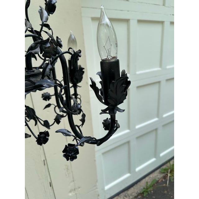 Old Lights On is pleased to offer this vintage five light black metal chandelier by Moe Light. It is wired and ready to...