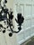 Old Lights On is pleased to offer this vintage five light black metal chandelier by Moe Light. It is wired and ready to...