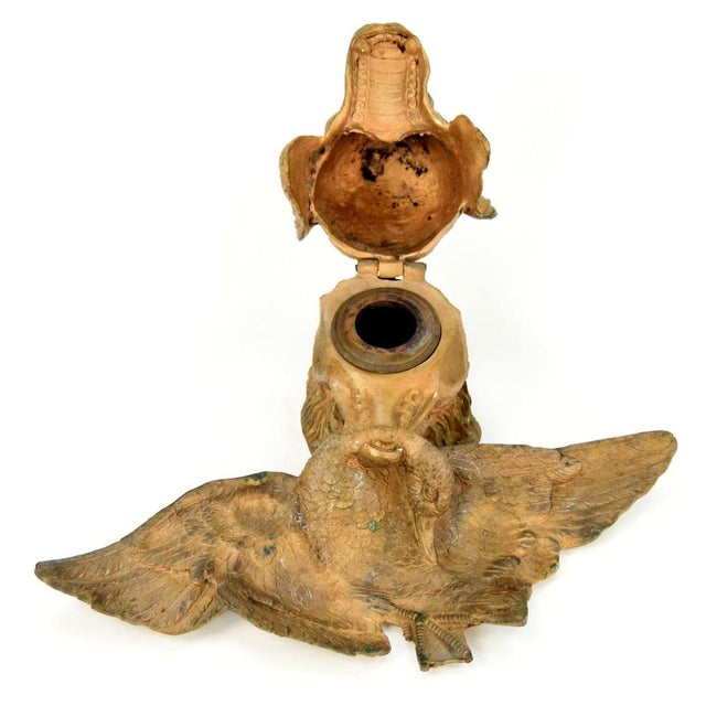 Bronze inkwell, made circa 1900. A bronze inkwell in the form of a hunting dog holding a captured duck. The outstanding...