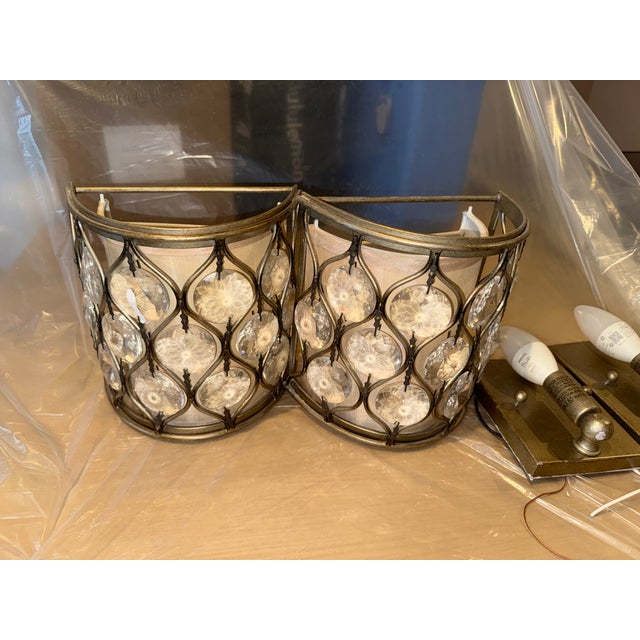 The Feiss Lucia one light wall sconce in burnished silver provides abundant light for your bath vanity, while adding a...