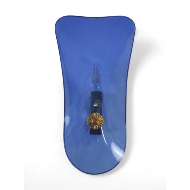 Set of 3 blue glass sconces from the 1950s. The design of these wall lamps can be attributed to Pietro Chiesa. There is no...