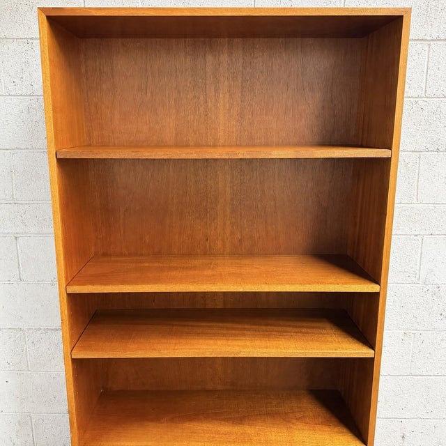 This Danish teak bookcase is a rare design by Willy Beck for Morten Olsen, and it has a great combination of open display...