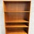 This Danish teak bookcase is a rare design by Willy Beck for Morten Olsen, and it has a great combination of open display...