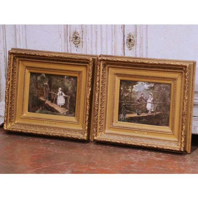 This charming pair of antique French pendants genre paintings, crafted circa 1870, is painted on board and presented in...