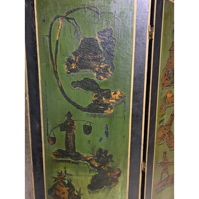 Dramatic antique chinese folding screen with Chinoiserie lacquer hand paintings of different scenes. Three different...