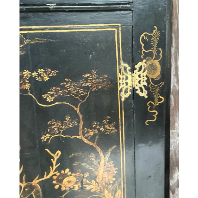 Elegant vintage Asian Chinoiserie corner cabinet designed to "float" gracefully in any corner. This piece features...
