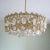 This round chandelier is made of gilded brass and crystal. I have official proof of authenticity such as vintage catalogs,...