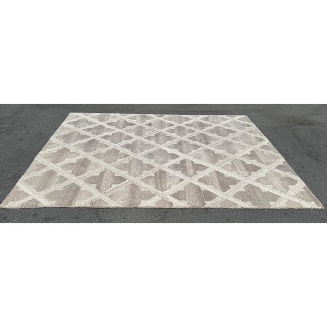 Design Plus Gallery presents an 8ft 2in × 10ft 1in Artisan de Luxe Home Fleur-de-Lys Area Rug. Made from 100% wool, the...