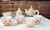 Description: A whimsical and collectible hand-painted set of 4 tea cups - pattern "Childrens Sampler" from Mackenzie-...