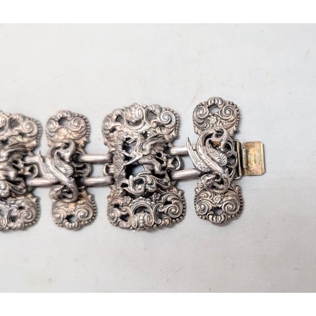 1972 silvertone coat of arms panels with rearing griffins with a coat of arms with a crown on top of it and sea serpents...