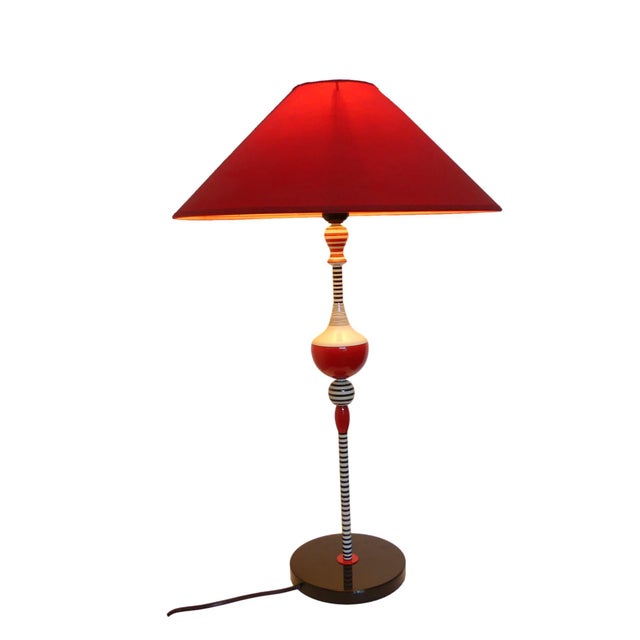 An exceptional and very rare table lamp from the Memphis era. This postmodern lamp was designed and manufactured by...