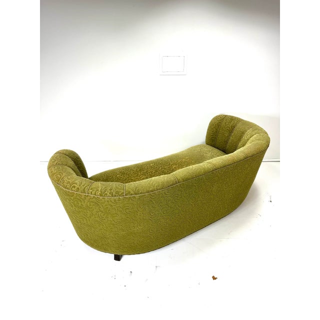 1940’s curved Danish sofa. Original upholstery. Birch legs.