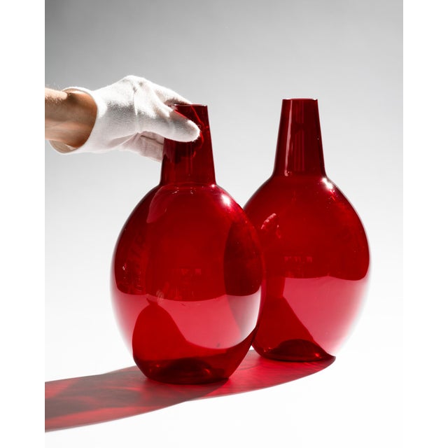 Hirschberg "Kalabasse" Vase Duo by Wilhelm Braun-Feldweg, Germany, pre-1958 A matched pair of ruby red glass vases from...