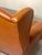Large Poltrona Frau armchair in cognac leather from the 1960s with ebonized wooden feet and the original plaque. The...