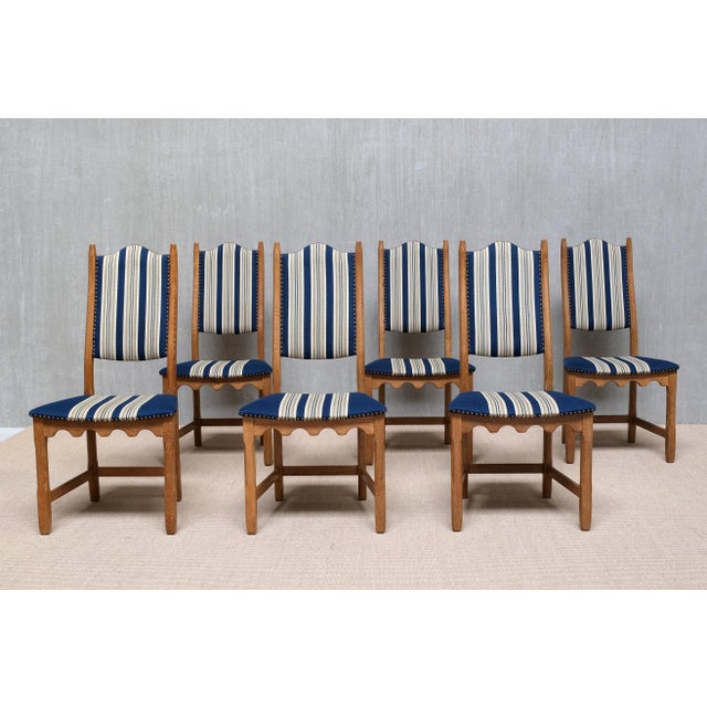 This striking set of six dining chairs was designed by Henning (Henry) Kjærnulf in the 1960s and produced by Nyrup...