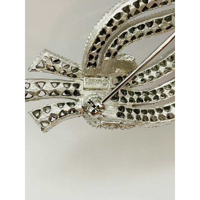 Mid-Century Modern 1963 Crown Trifari, Signed, Cavalcade Collection Brooch, Blue Rhinestone, Silver Tone For Sale - Image 3 of 3