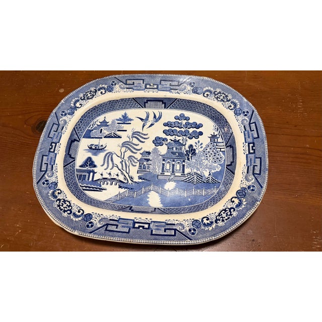 Antique Staffordshire Blue Willow Transfer Ironstone Oval Platter, Circa 1860s A classic and enduringly beautiful example...