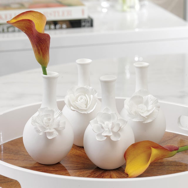 Turning tradition on its head with the fun chic of this 4-piece mini bud vase set. Use as one or in multiples to create...