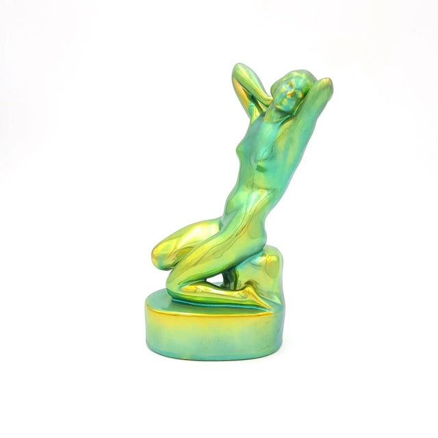 A Zsolnay Art Deco nude in classic iridescent green glaze, Hungary circa 1920.