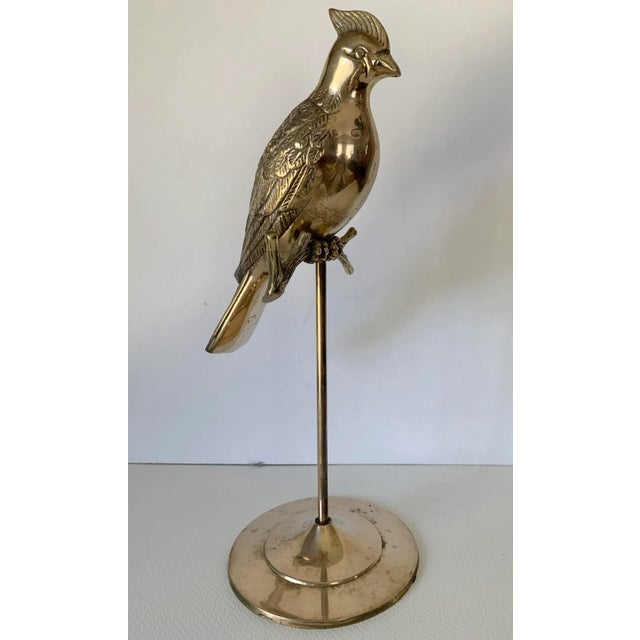 Charming 15 inch brass bird perched on a branch and set on brass stand. Made from heavy brass with wonderful details.