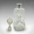 This is an antique decorative port decanter. An English, glass and sterling silver spirit bottle with Birmingham...