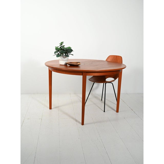 Extendable round teak table from the 1960s designed by Svante Skogh for Seffle Möbelfabrik, with original branding....