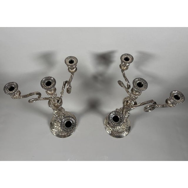 Pair of rococo candelabra in 950 sterling silver. in the 18th-century louis xv style. the circular base with contoured...