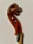 This is a folk art carved violin head on custom made iron stand. The head of the violin has been carved into the head of a...