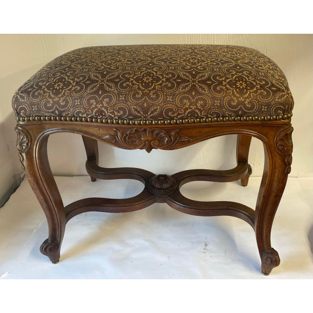 Lovely carved wood French bench that has been professionally re-upholstered.