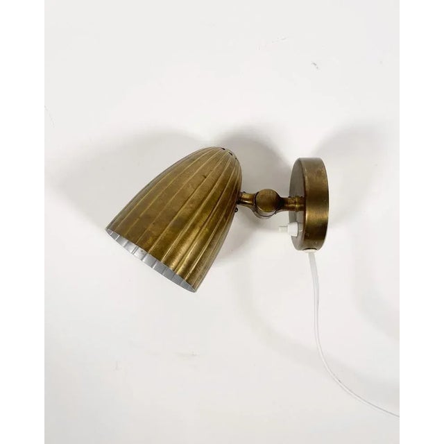 Swedish Brass wall lamp by Harald Notini for Böhlmarks Lampfabrik, 1940s. This piece has an attribution mark, I am sure...