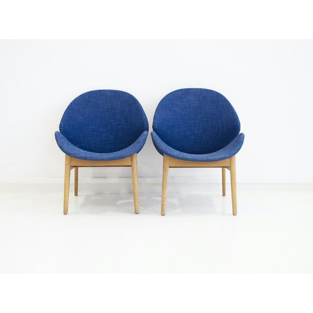 Pair of chairs designed by Hans Olsen in 1955 with oak frame, seat and back made of bentwood, upholstered in blue wool....