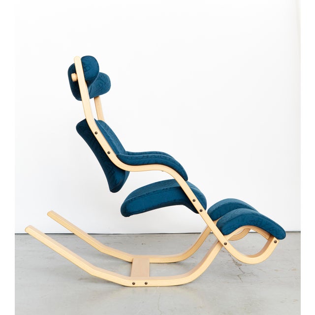 Office/rocking chair from Norway by Stokke. Upholstered in blue fabric. Excellent condition. This piece has an attribution...