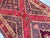A genuine antique Qashqai-Shiraz tribal runner, hand-knotted in lustrous wool — two bold stacked diamond medallions...