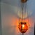 Beautiful antique Victorian hanging oil lamp featuring a stunning ruby swirl art glass font housed in an ornate brass...