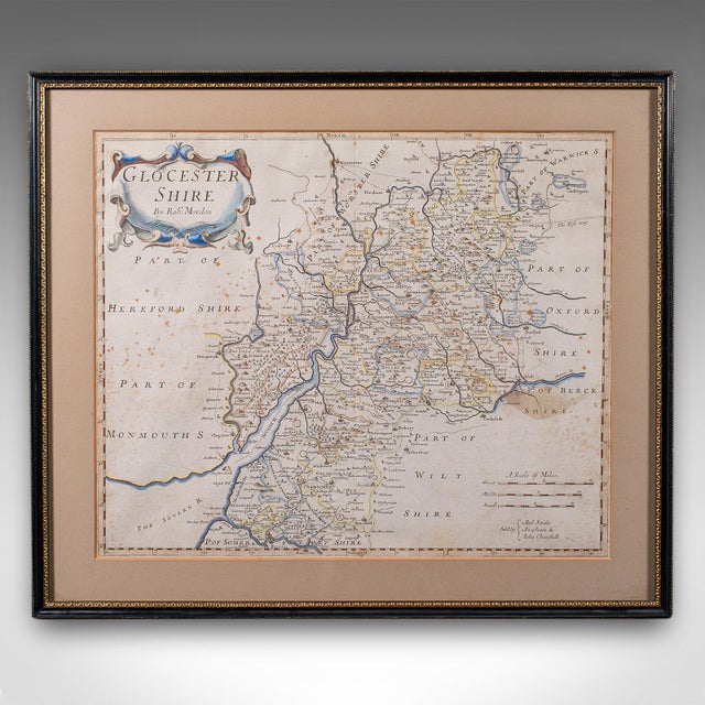 This is an antique framed map of Gloucestershire. An English, atlas engraving of cartographic interest By Robert Morden,...