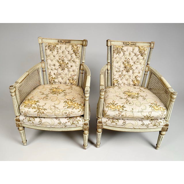 A distinguished matched pair of French Louis XVI-style bergère armchairs by Hibriten Chair Co., Inc. of Lenoir, North...
