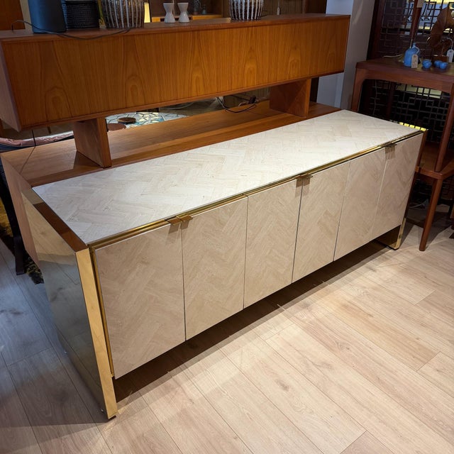 Ello herringbone travertine and brass credenza, likely late 1970s/early 1980s. Soft tonal herringbone travertine against...