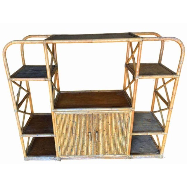 Mid-century Frankl style seven-level rattan shelf room divider wall with mahogany shelving. The unit features a unique...