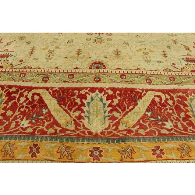 51879 Antique Turkish Oushak Rug, 10’00 x 11’02. This hand-knotted wool antique Turkish Oushak rug exemplifies the...