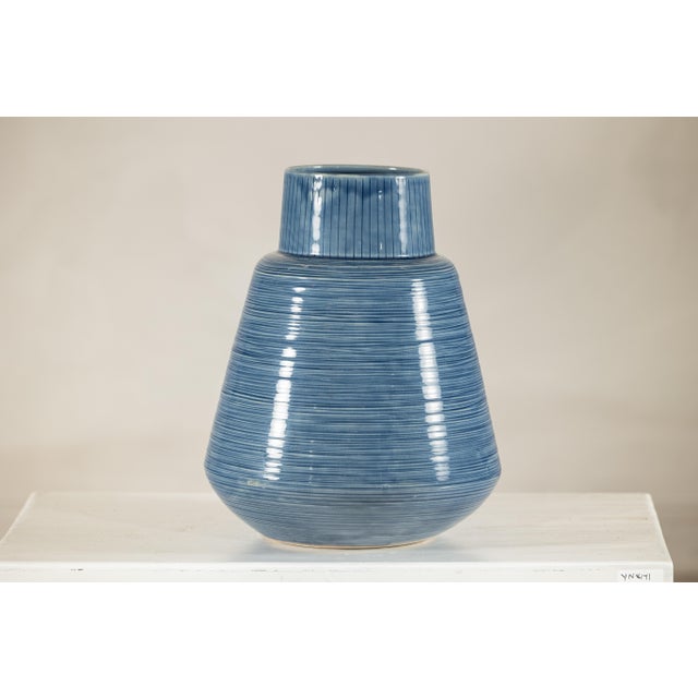 "About the Item This artisan-crafted ceramic vase features a well-balanced, tapering form with a subtly stepped profile,...